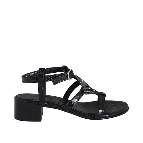Woman's sandal in black laminated...