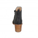 Woman's ankle boot with zipper and elastic band in black pierced leather with heel 7 - Available sizes:  42