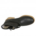 Woman's ankle boot with buckle and zipper in black leather and pierced leather heel 3 - Available sizes:  42